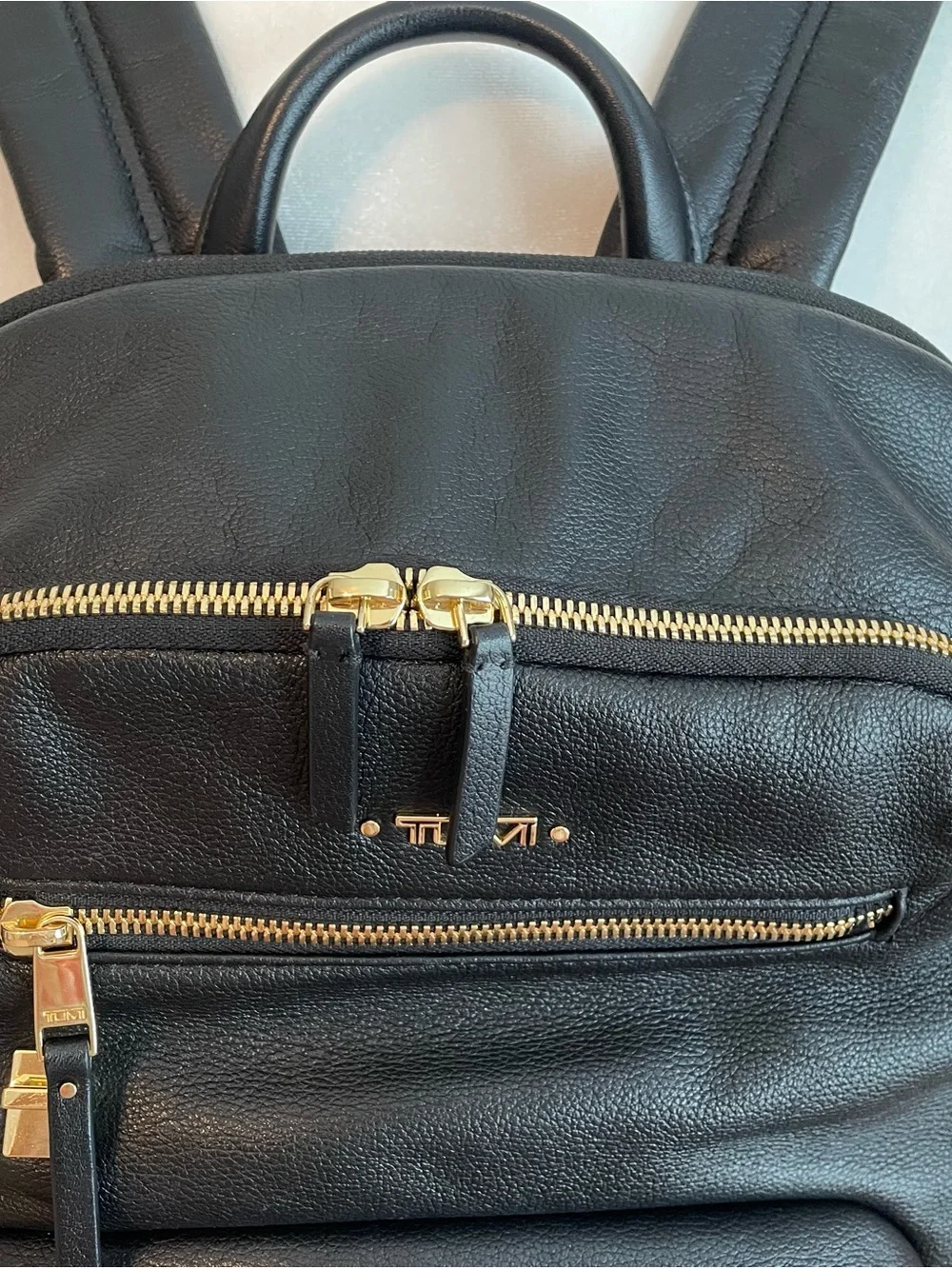 Tumi Black Leather Backpack with Goldtone Hardware